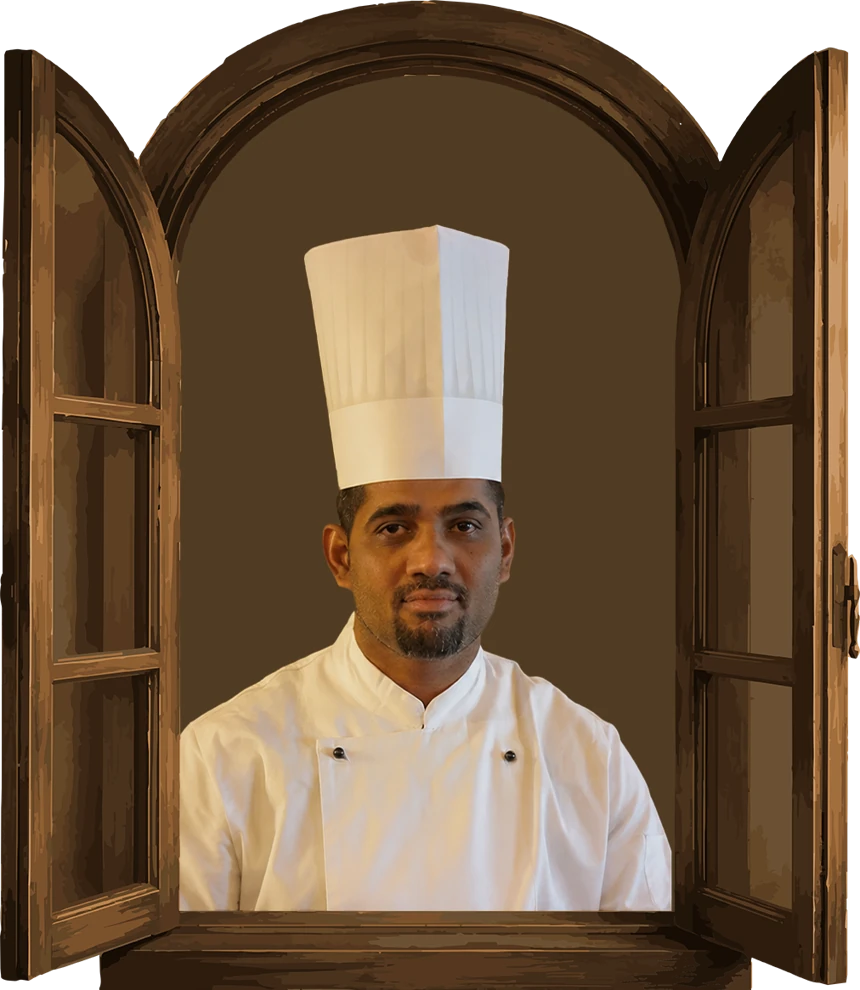 Chef Sadun schaut aus einem geöffneten Holzfenster
